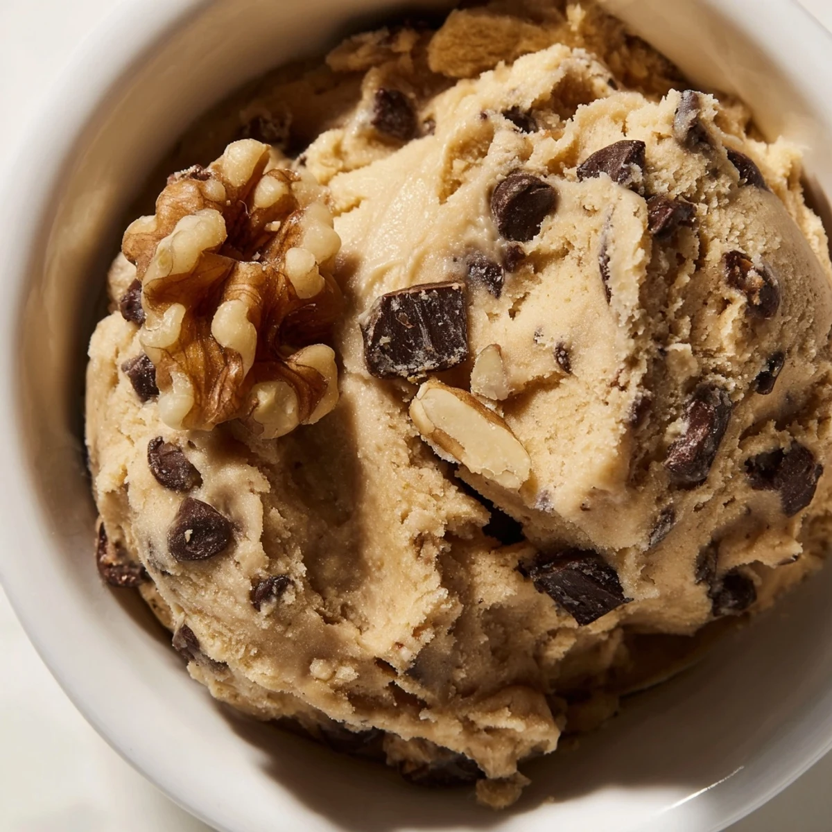 Spoonful of Guilt Free Greek Yogurt Cookie Dough topped with chopped nuts for extra crunch.