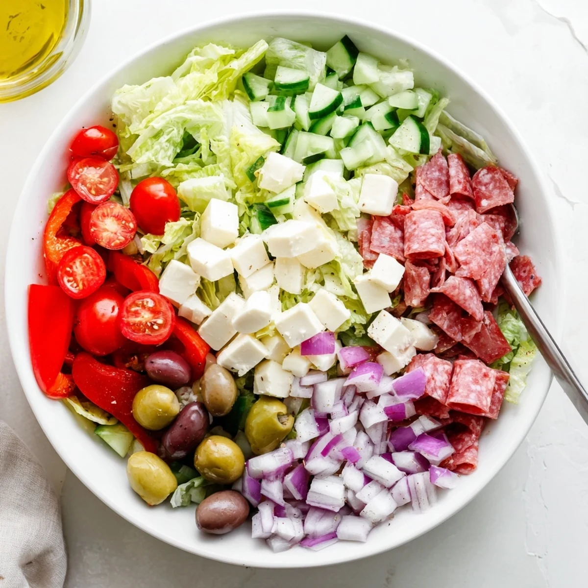 Crunchy Italian chopped salad with homemade dressing served as a light main dish with crusty bread on the side