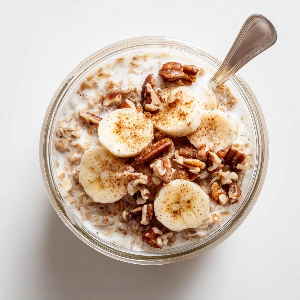 Rich brown sugar overnight oats with vanilla-infused milk and garnished with pecans for an easy make-ahead meal