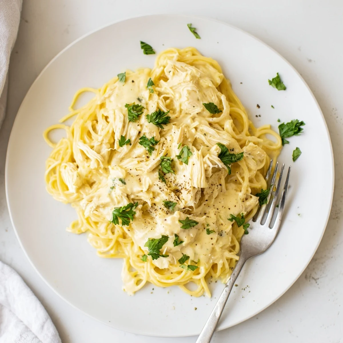 Family-style Crock Pot Angel Chicken platter featuring shredded chicken and savory Italian dressing sauce