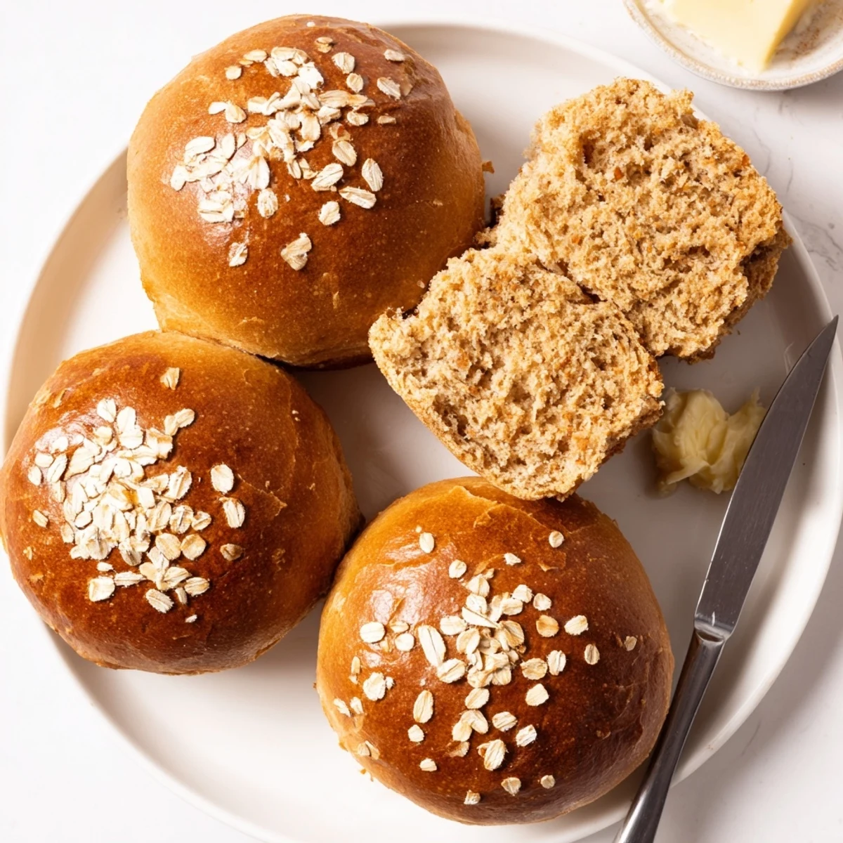 Rustic Oatmeal Molasses Dinner Rolls steaming, golden crust, oats sprinkled on top