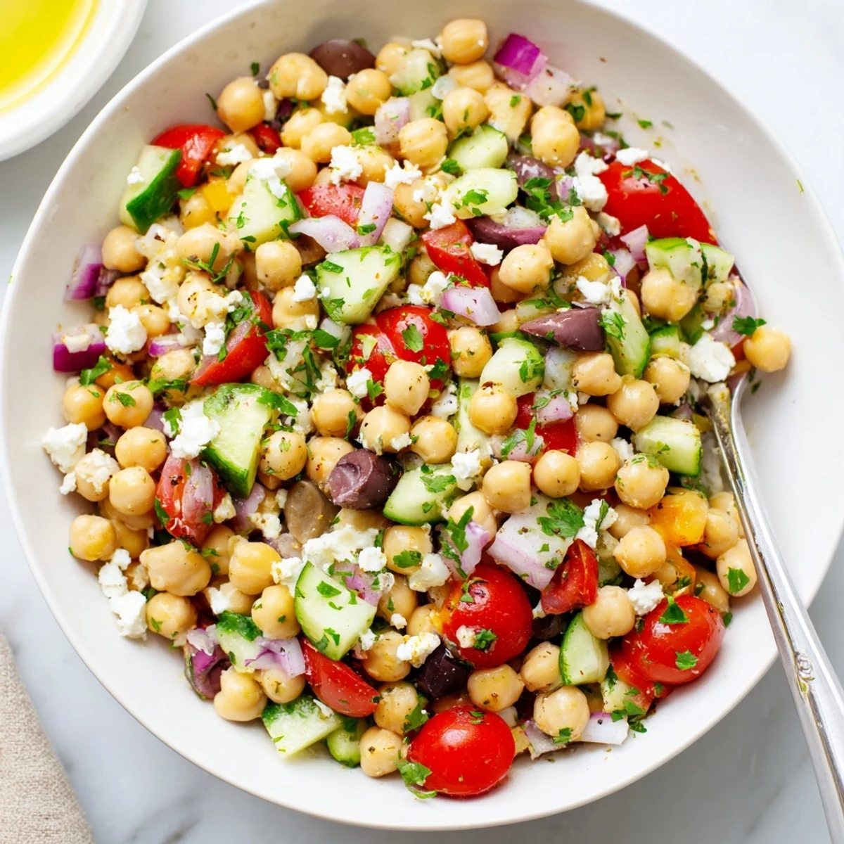 Vibrant Mediterranean Chickpea Delight with zesty lemon herb dressing, crisp vegetables