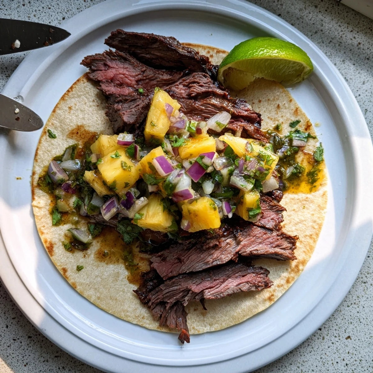 Grilled, charred Savory Beef Al Pastor Tacos Delight with pineapple and lime  