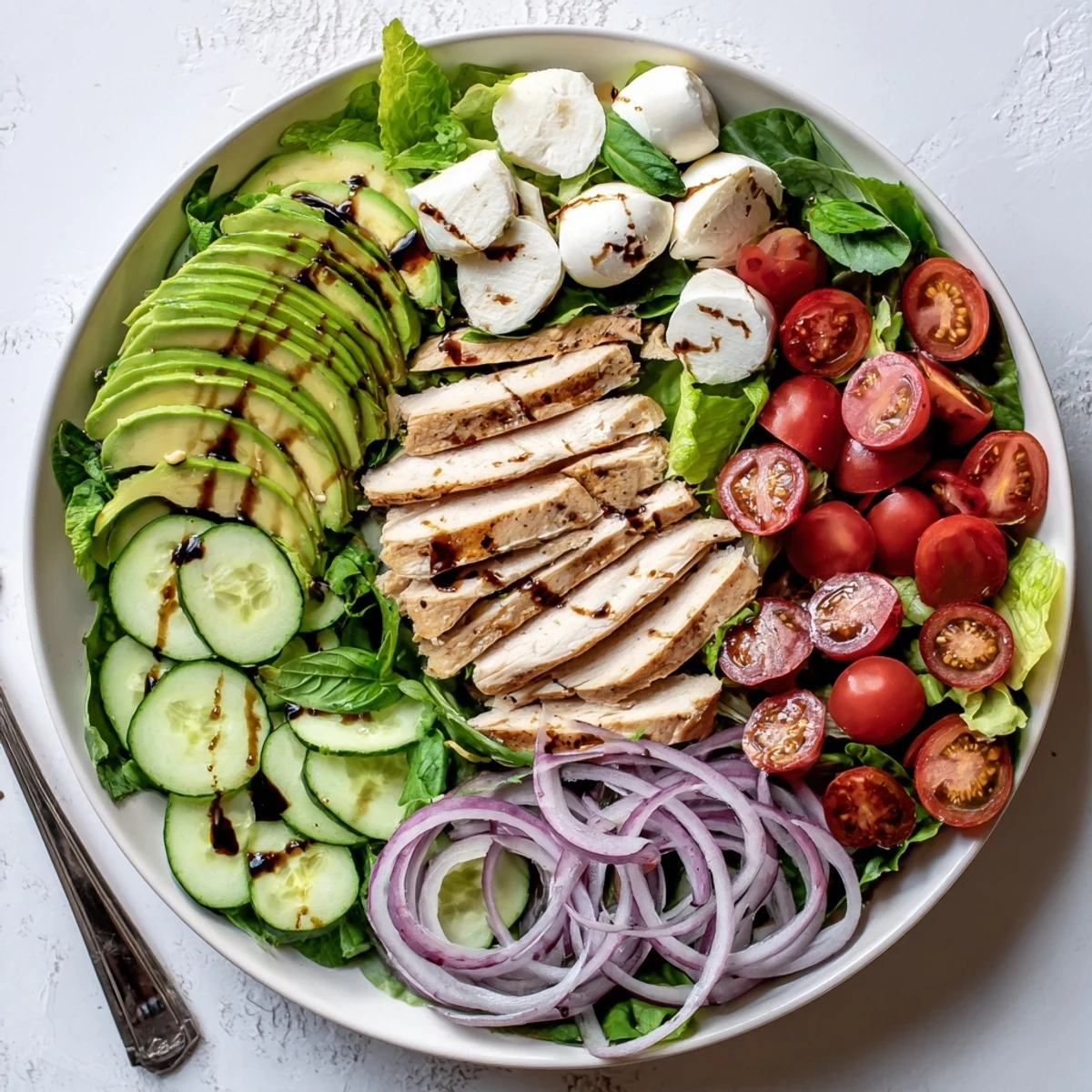 Bright Baked Marinated Chicken Salad With Mozzarella And Balsamic Vinaigrette tossed with basil.