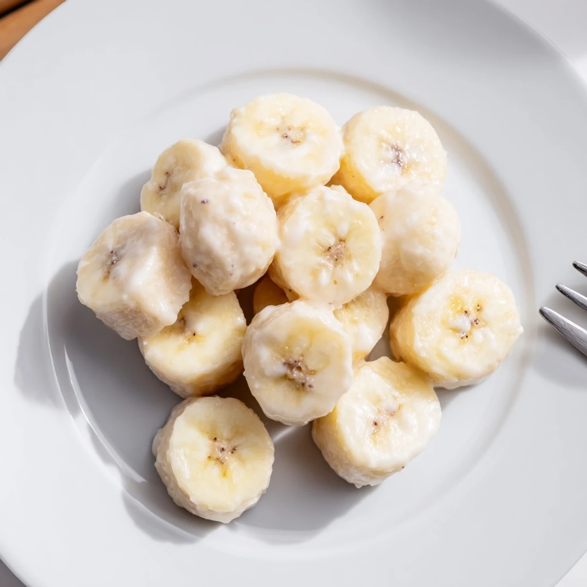 Tray of Frozen Banana Yogurt Bites cooling in freezer, bite-sized, refreshing