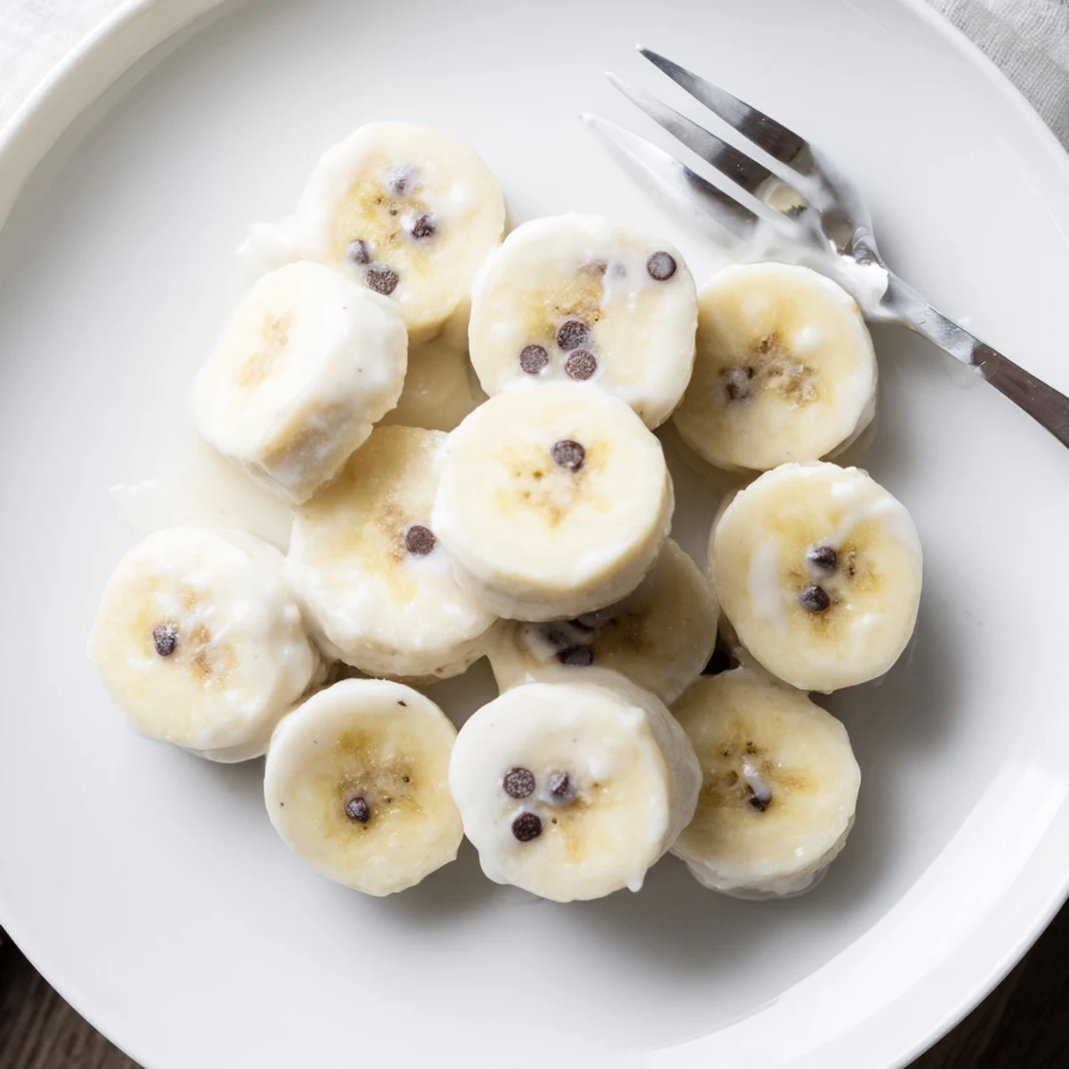 Homemade Frozen Banana Yogurt Bites taste creamy with coconut and crunchy nuts