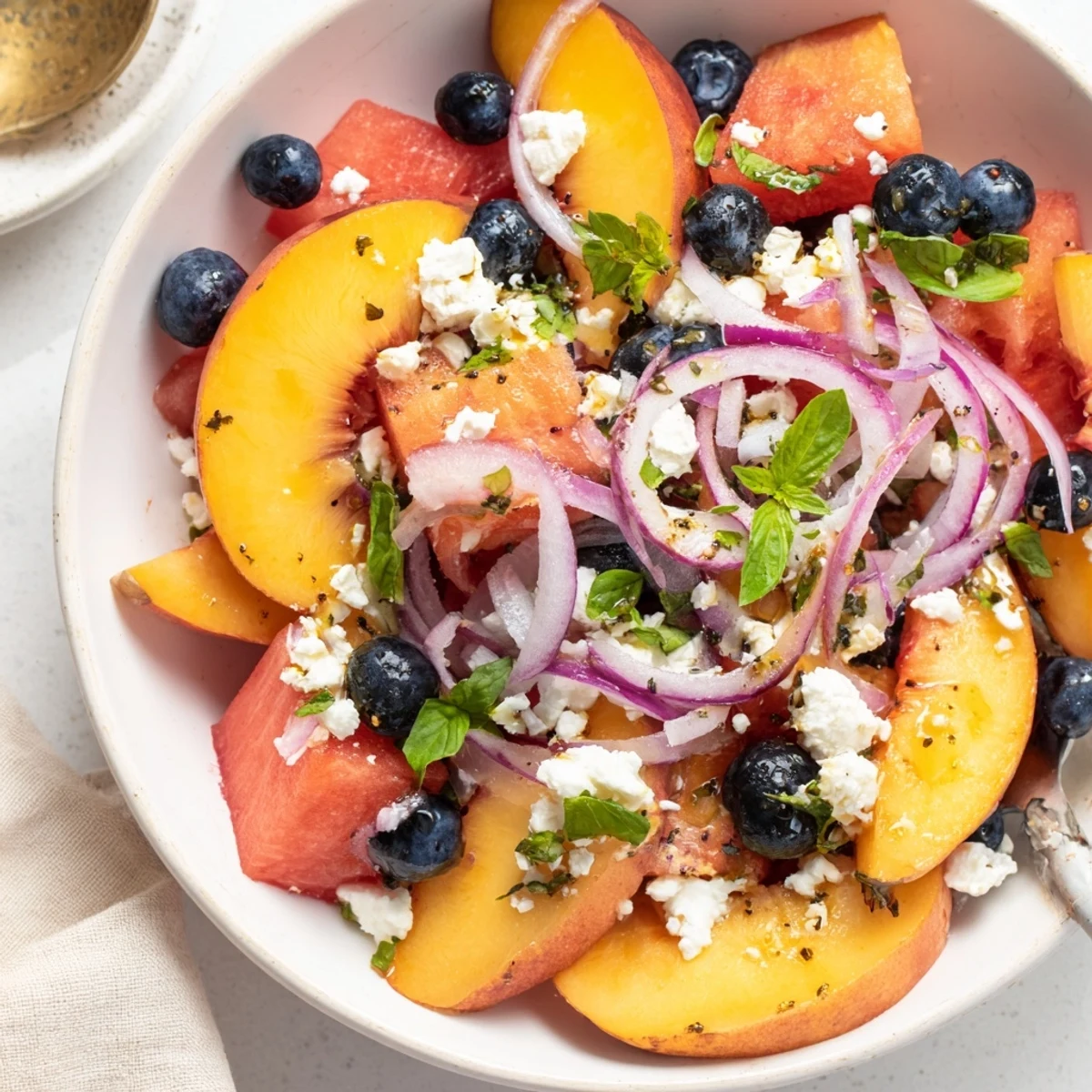Peach Watermelon Salad With Feta featuring sweet fruit, tangy cheese, crunchy red onion