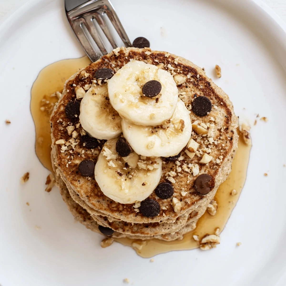 Warm Protein Banana Pancakes steaming on a griddle, cinnamon aroma rising