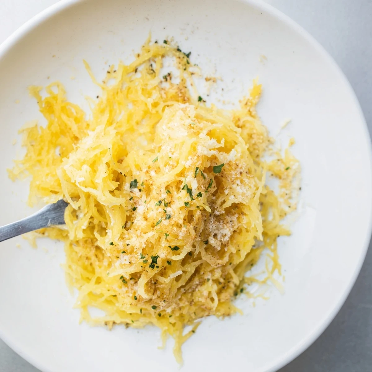 Spaghetti Squash Mac Cheese piled in a baking dish, creamy golden topping