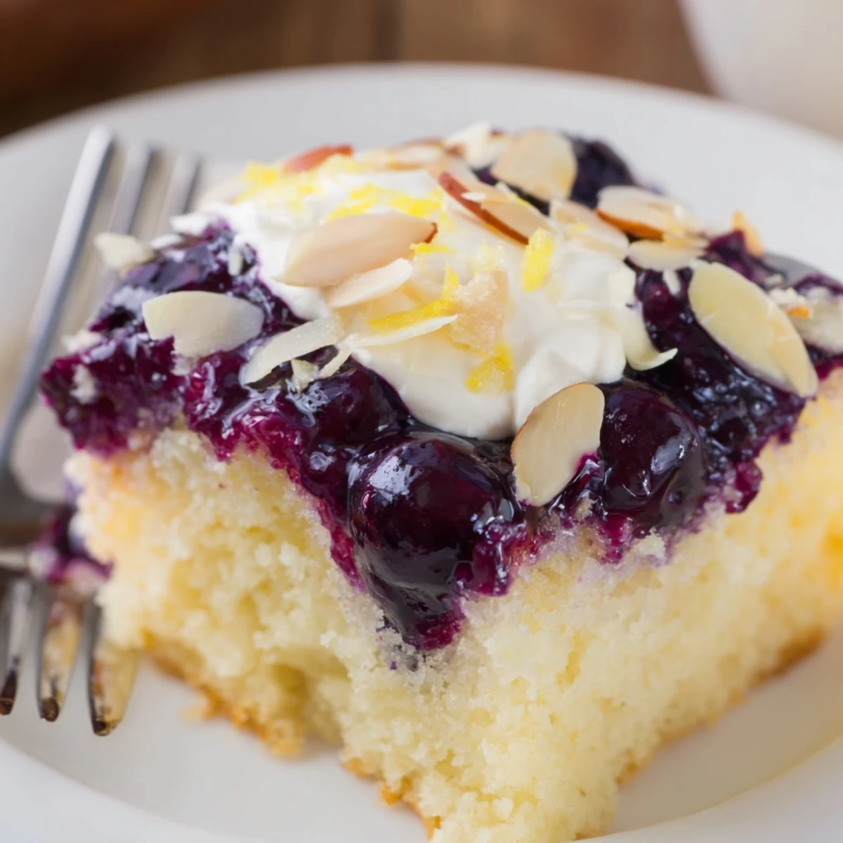 Served with tea: Lemon Blueberry Poke Cake With Almond Topping, whipped almond cream crowning.