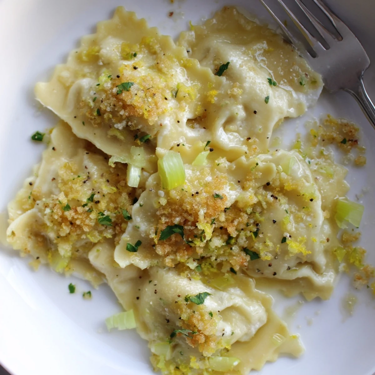 Golden leek burrata triangoli drizzled with tangy lemon butter and crispy breadcrumbs