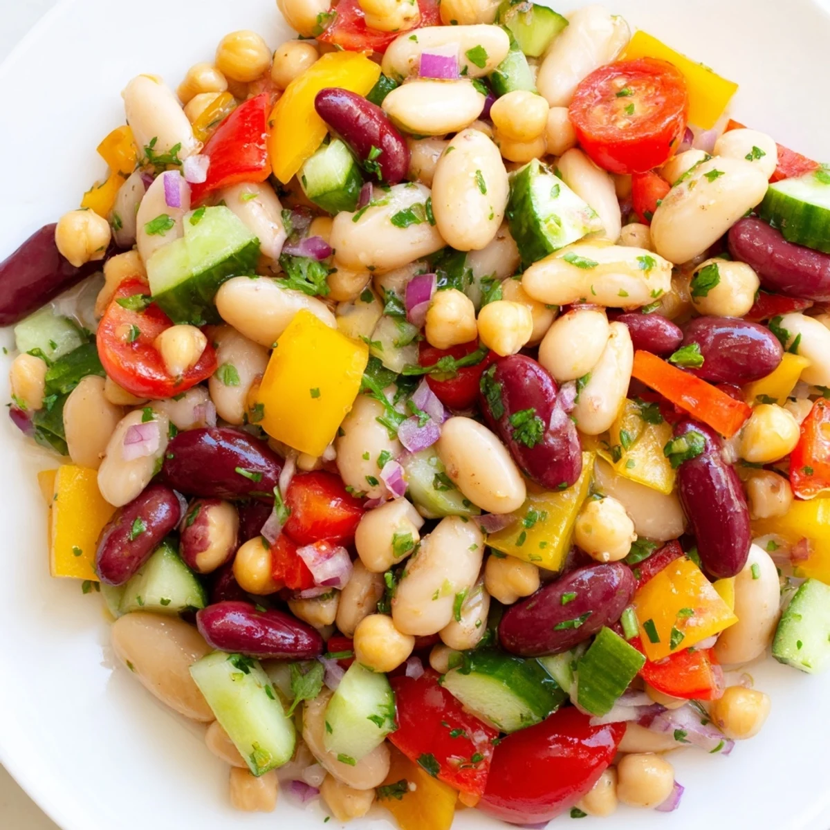 Colorful Italian bean salad with crisp peppers, juicy tomatoes, and tangy vinaigrette