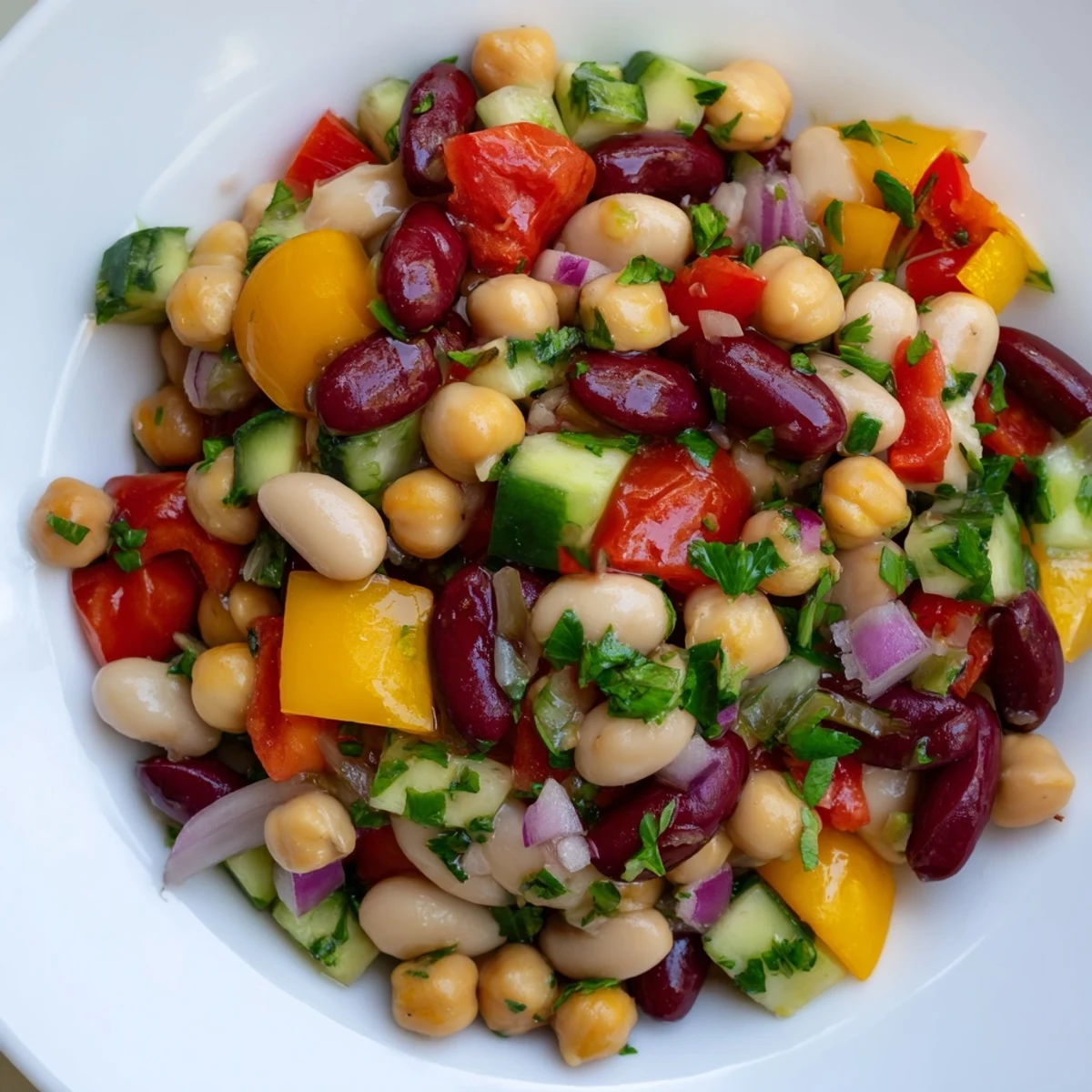 Bright Italian bean salad served in a bowl with fresh herbs and vegetables