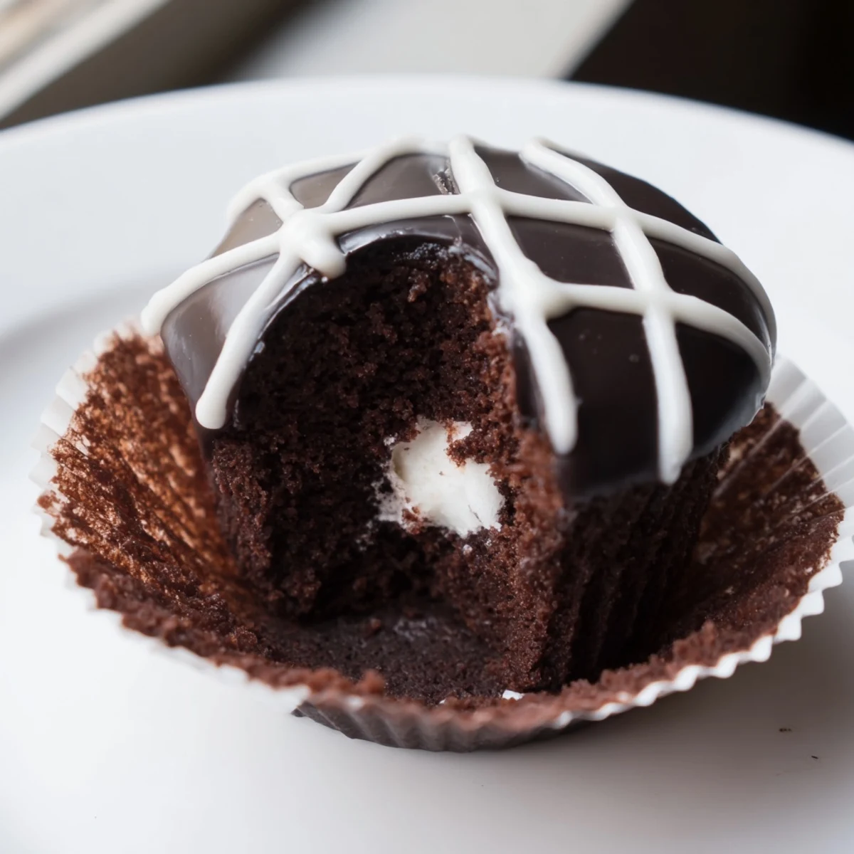 Fluffy marshmallow-filled Homemade Hostess Cupcakes dipped in rich dark chocolate ganache
