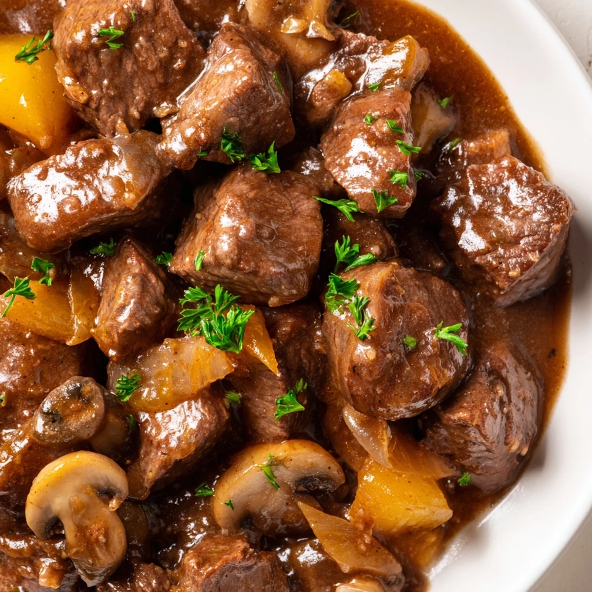 Tender weeknight steak tips and gravy smothered over creamy mashed potatoes