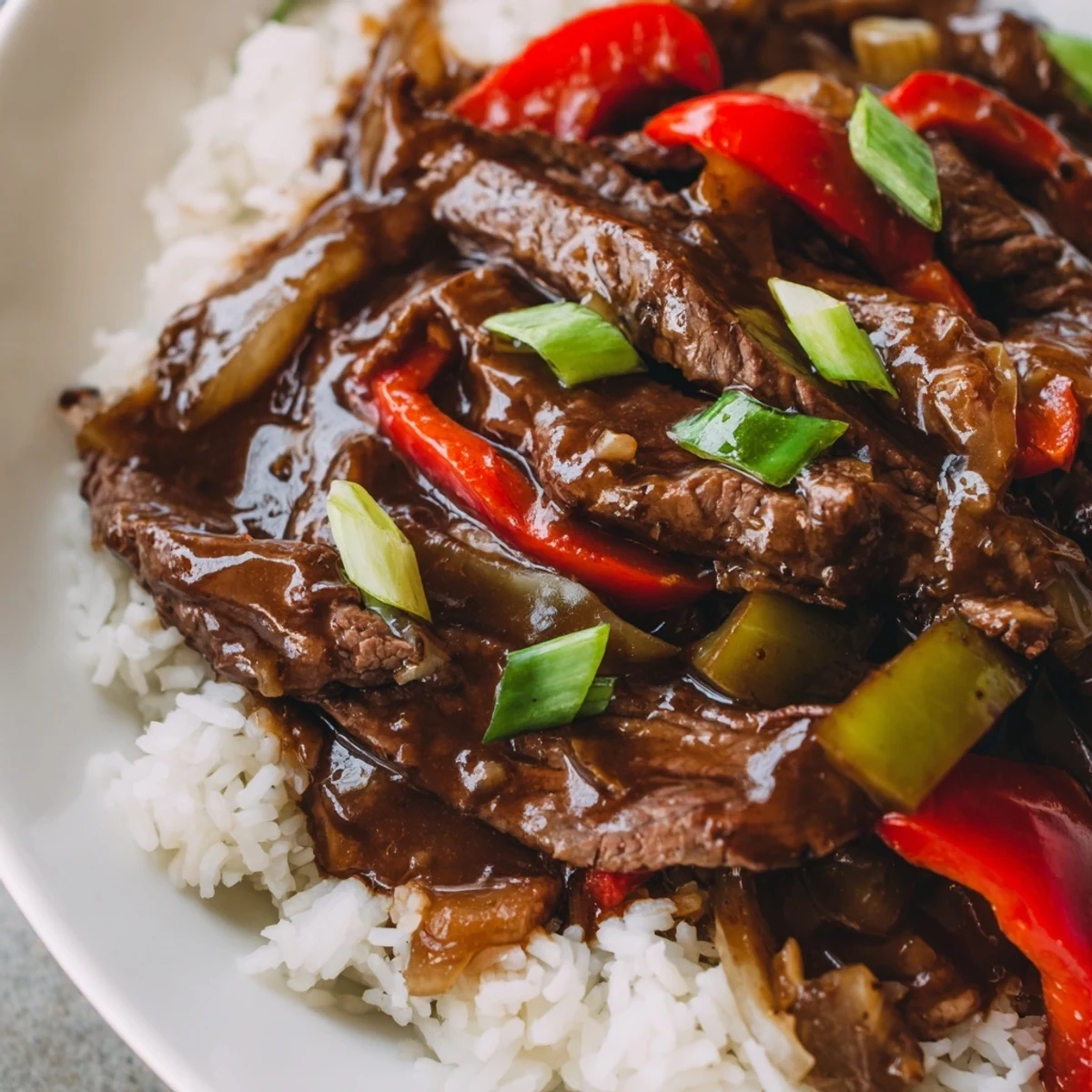 Slow Cooker Pepper Steak with tender beef and colorful bell peppers in rich savory sauce