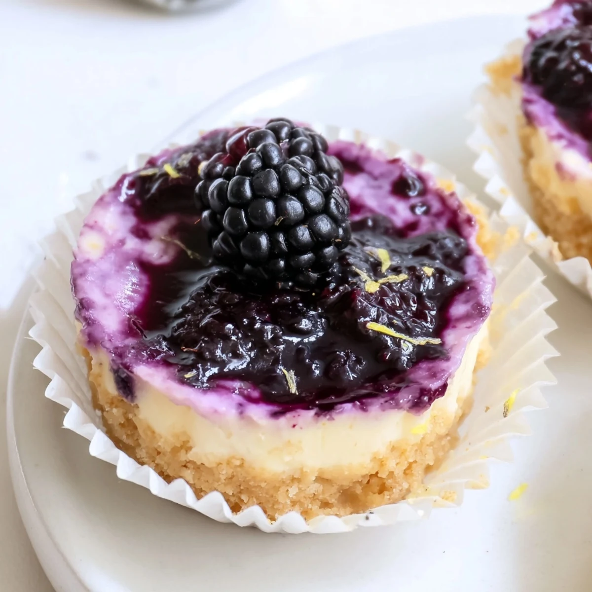 Silky lavender-infused filling sits atop a buttery graham crust in these no bake mini blackberry lavender cheesecakes