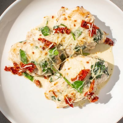 Golden-baked Marry Me Low Carb Chicken Casserole features tender chicken breasts coated in rich, cheesy sauce.